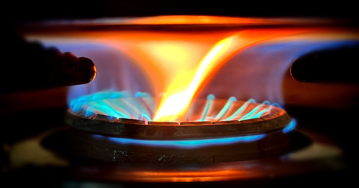 Natural gas valve with blue flame in a modern French kitchen