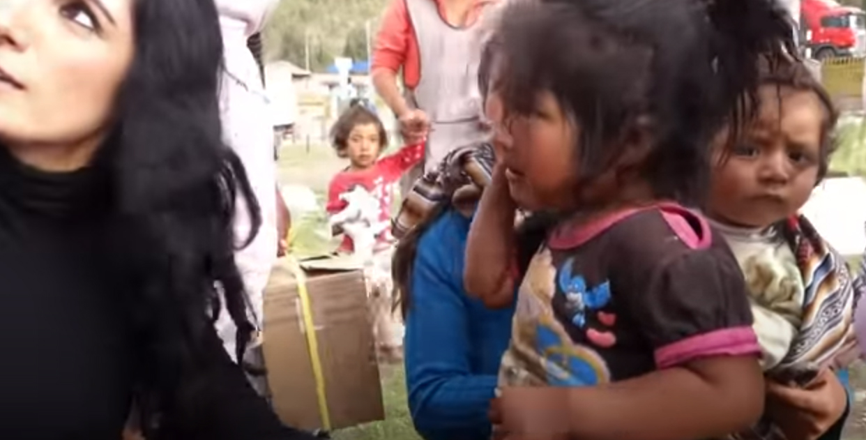 She distributes toys and clothes to children around the world