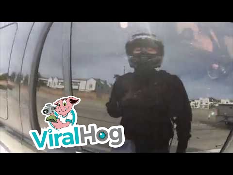 A biker helps a driver on a highway